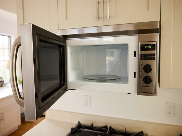 An over-the-range microwave with the door open in a Toronto kitchen